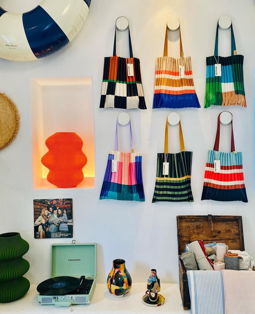 A shop in Koufonisia, displaying colorful bags and a record player